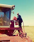 dad on combine at farm